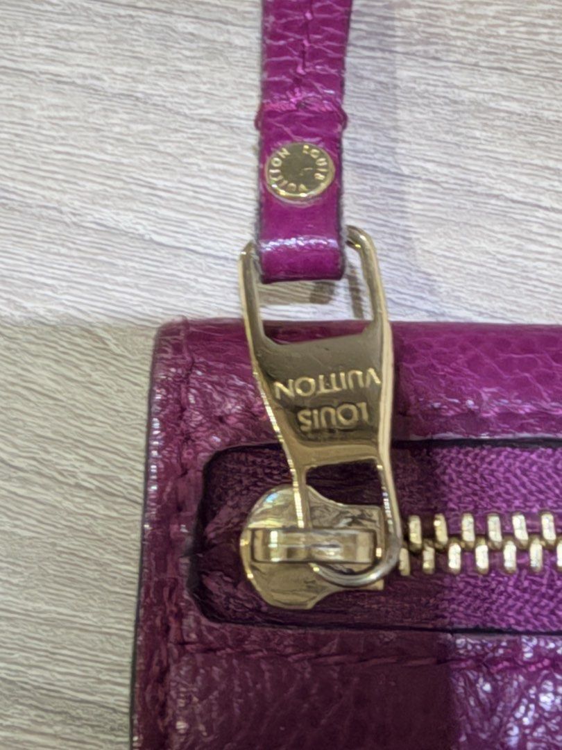 Louis Vuitton Monogram Empreinte Pouch (Category: Luxury Bags & Wallets) located in Pasig City. Submitted by theclosetcasemanila (Listing ID 1451613914, Image 3). Description: - Authentic Louis Vuitton Pouch - Vibrant Pink Color - Iconic Monogram Empreinte Pattern - Zippered Compartment - Snap Closure - Made in France - Perfect for storing cards and cash - Good condition. No dents or scratches. - Missing keychain strap inside (hence the blank hol
