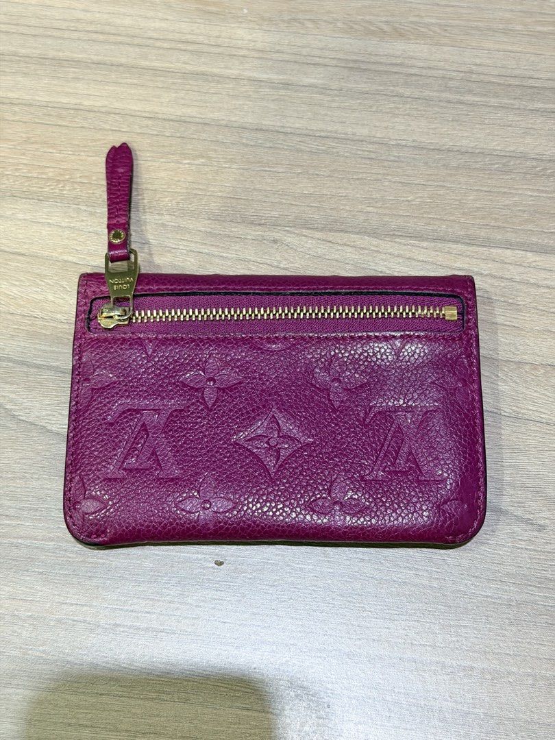 Louis Vuitton Monogram Empreinte Pouch (Category: Luxury Bags & Wallets) located in Pasig City. Submitted by theclosetcasemanila (Listing ID 1451613914, Image 2). Description: - Authentic Louis Vuitton Pouch - Vibrant Pink Color - Iconic Monogram Empreinte Pattern - Zippered Compartment - Snap Closure - Made in France - Perfect for storing cards and cash - Good condition. No dents or scratches. - Missing keychain strap inside (hence the blank hol