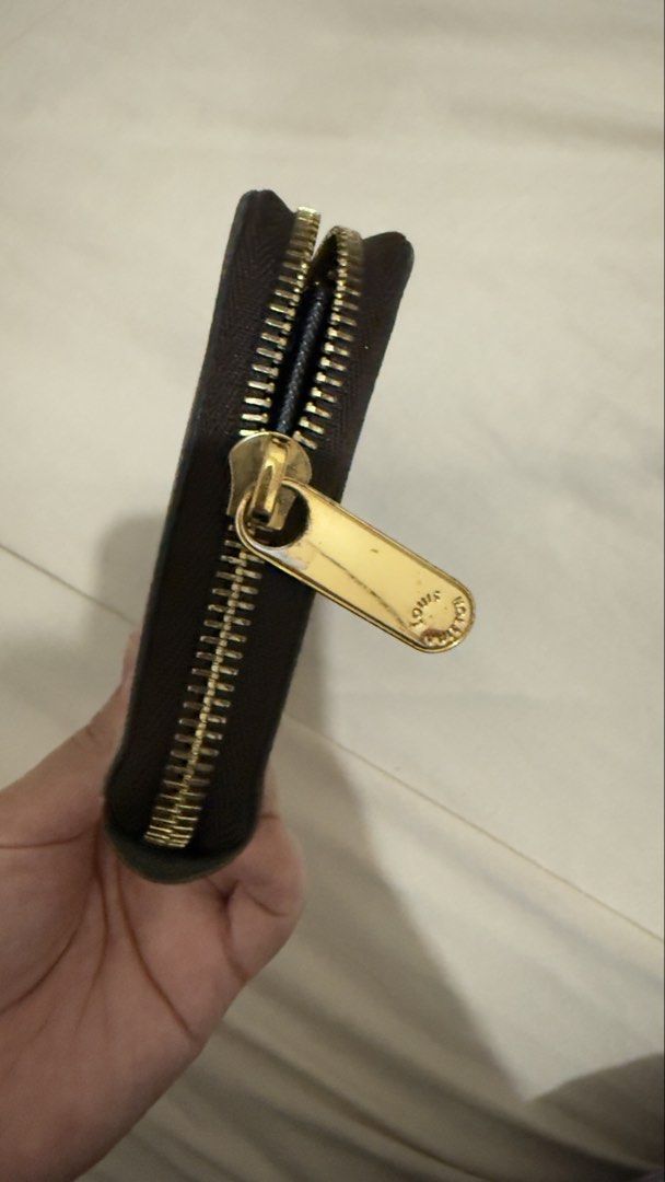 Louis Vuitton Zippy Monogram Giant Long Wallet (Category: Luxury Bags & Wallets) located in Manila. Submitted by mschasaha60513 (Listing ID 1451688834, Image 3). Description: ORIGINAL Brown Louis Vuitton wallet with signature monogram pattern. Zip-around closure. Interior has multiple card slots and compartments. Gold-tone hardware. Great for organizing your essentials..