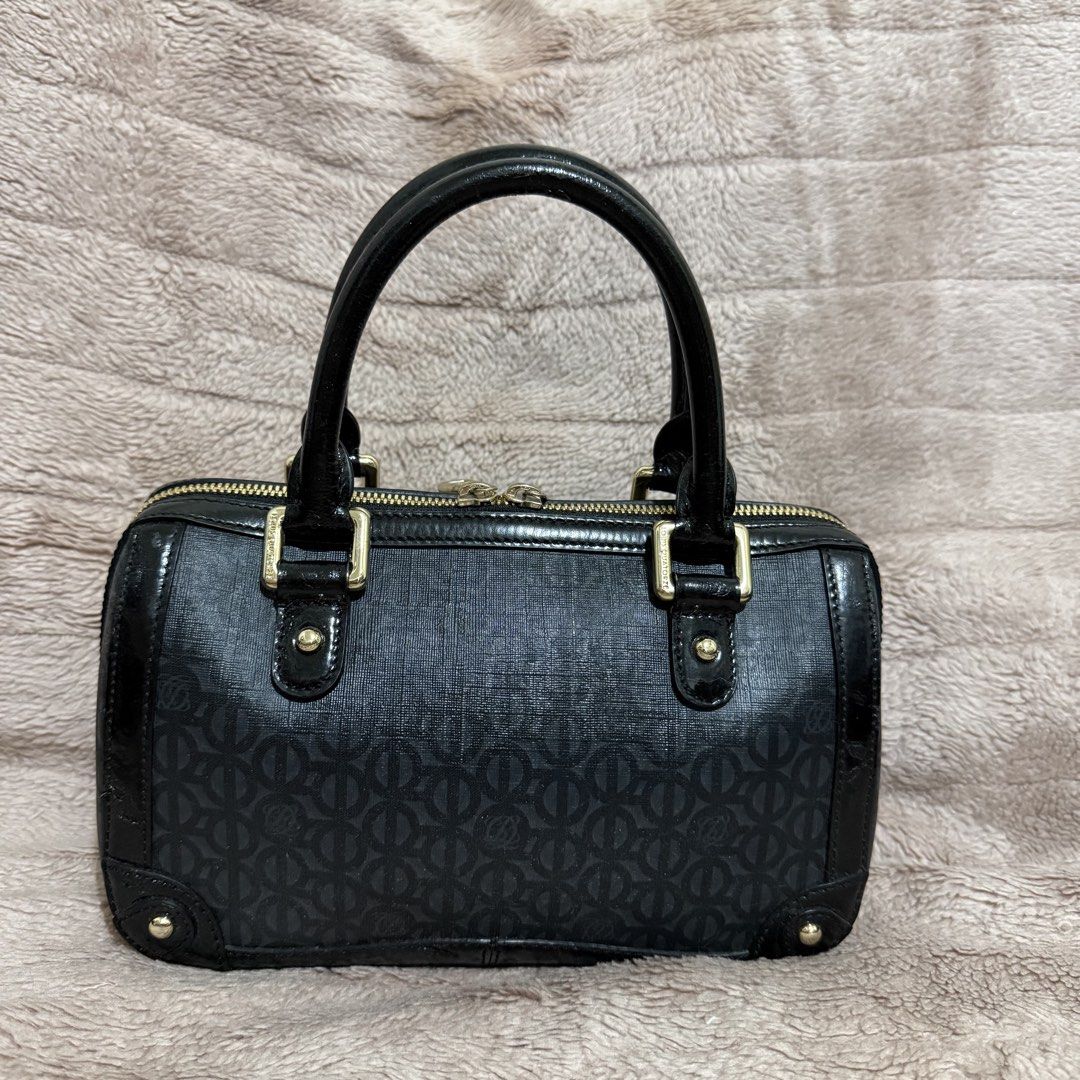 LQ Black Monogrammed Boston Bag with Gold Hardware (Category: Luxury Bags & Wallets) located in Bulacan. Submitted by trendsettersquad (Listing ID 1451687393, Image 2). Description: 🏷️ Item Code: BW02 👜 Brand: Louis Quatorze 📏 Dimensions: 9 × 6 × 4 in. ✨ Condition: Authentic. Good overall condition with patent leather blistering (still intact and barely visible) on the trim due to age and seldom use. Priced accordingly. .