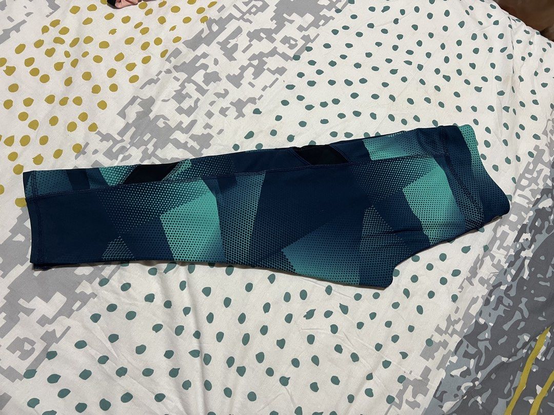 Lululemon Align Crop Leggings Geometric Print Size 6 (Category: Activewear) located in Antipolo. Submitted by murapod2 (Listing ID 1451532161, Image 1). Description: - Lululemon Align Crop Leggings - Size: 6 - Design: Teal and navy blue geometric pattern - Features: Mesh panels on the sides - Material: Comfortable and stretchy - Perfect for: Workouts or casual wear.