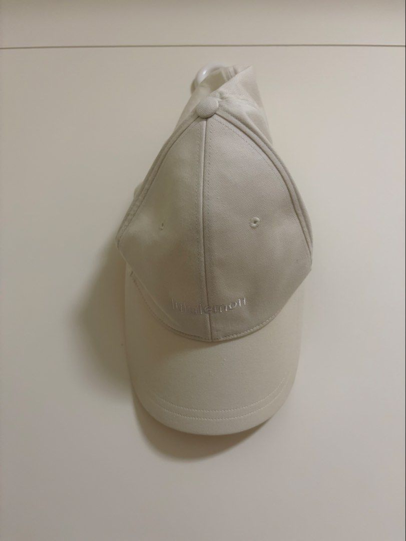 Lululemon Baseball Cap - Cream/Off-White (Category: Caps & Hats) located in Pasig City. Submitted by kevinl12345 (Listing ID 1449139072, Image 1). Description: - Cream Lululemon baseball cap - Size L/XL - Adjustable strap with metal hardware - Embroidered Lululemon logo on front and strap buckle - Made in Vancouver.