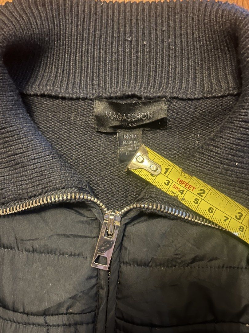 Magaschoni Man Hybrid Quilted Puffer Knit Jacket - Medium (Category: Coats, Jackets and Outerwear) located in Lipa City. Submitted by alexcollectionco (Listing ID 1451669779, Image 3). Description: Magaschoni Man full-zip hybrid cardigan jacket featuring a quilted insulated front panel with ribbed knit sleeves and back panel. Sleek, tactical-inspired design with a high stand collar and full front zip, perfect for gorpcore, quiet luxury, minimalis