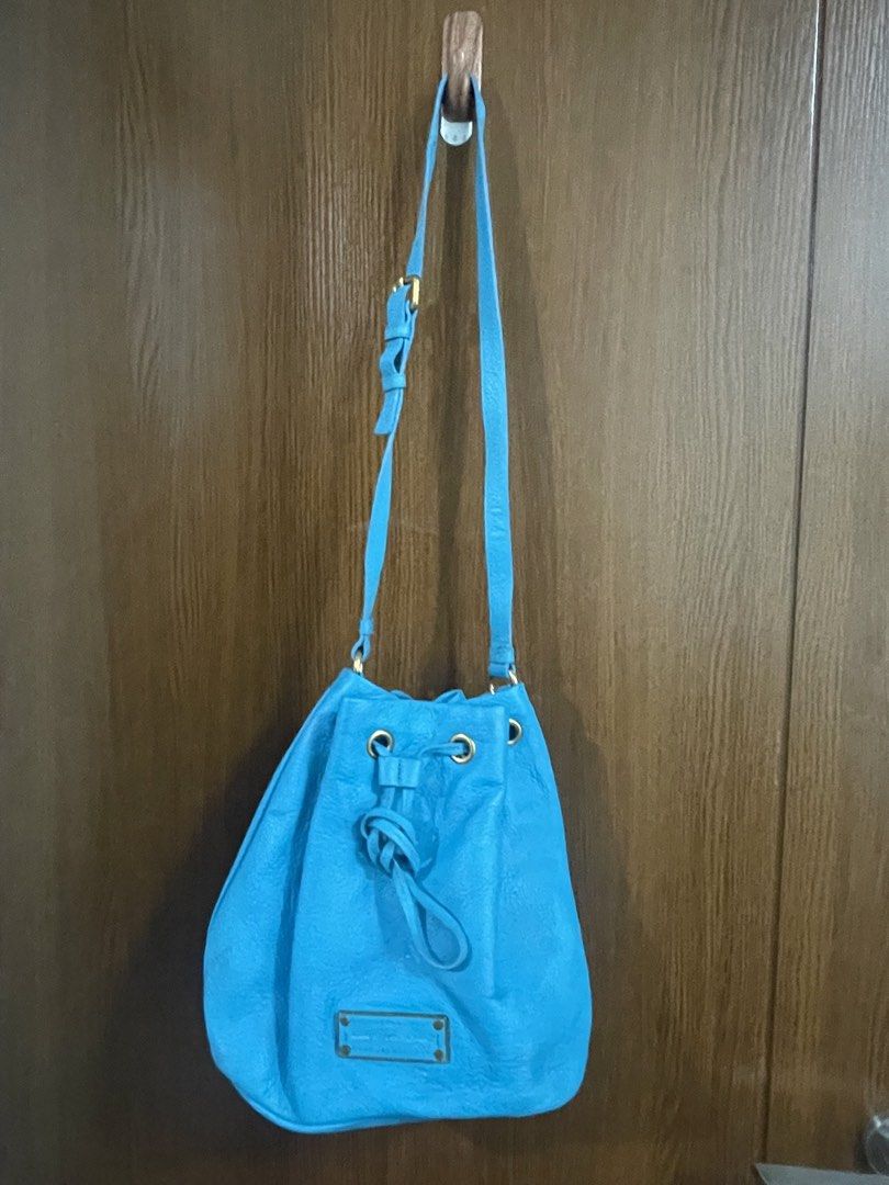 Marc Jacobs Blue Leather Bucket Bag (Category: Luxury Bags & Wallets) located in Manila. Submitted by misyeli (Listing ID 1451567198, Image 2). Description: - Brand: Marc by Marc Jacobs - Color: Blue - Material: Leather - Style: Bucket Bag - Closure: Drawstring - Hardware: Gold-tone - Interior: Small zip pocket - Use: Great for everyday - Sourced from a Thrift shop abroad, .