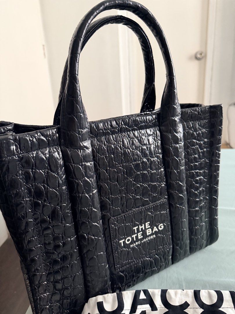 Marc Jacobs The Tote Bag Black Croc Embossed (Category: Luxury Bags & Wallets) located in Mandaluyong City. Submitted by 7thstudiobyk (Listing ID 1451594067, Image 2). Description: - Authentic Black Marc Jacobs Tote Bag - Luxurious Croc Embossed Leather - Includes Original Dust Bag and Authenticity Card - Versatile: Top Handles and Detachable Shoulder Strap - Spacious Interior for Daily Essentials - Ideal for Everyday Use Description: - Marc Jaco