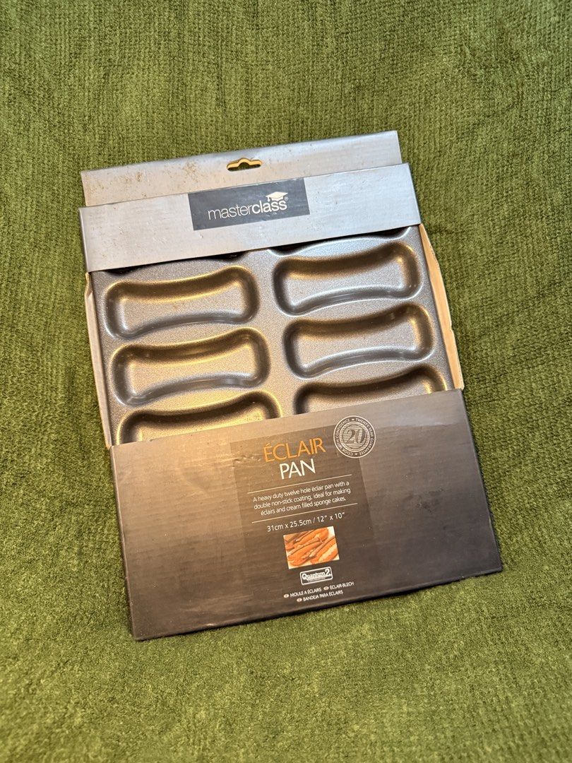 MasterClass Eclair Pan (Category: Bakeware) located in Manila. Submitted by georgethjafine (Listing ID 1451688767, Image 1). Description: - Brand: MasterClass - Product: Eclair Pan - Features: Heavy-duty, non-stick coating - Capacity: Makes 6 éclairs - Dimensions: 31cm x 25.5cm (12" x 10") - Ideal for éclairs, cream cakes, and more - Condition: Brand new.