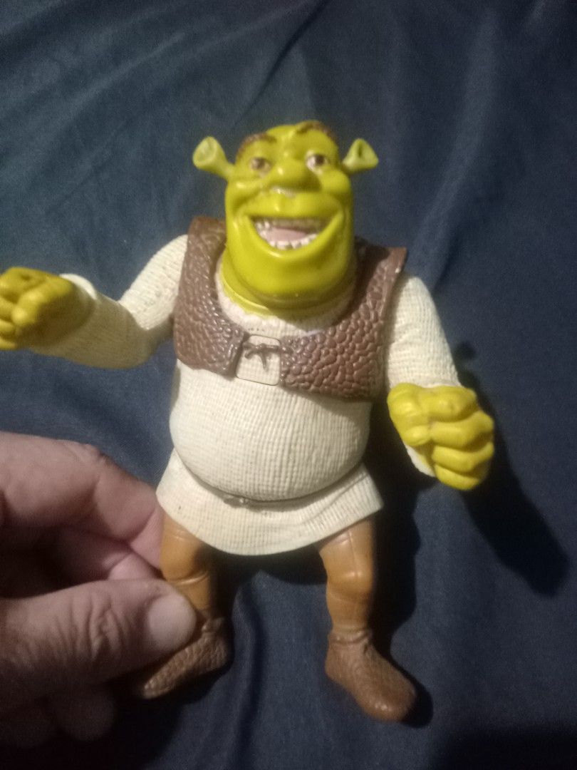 McDonald's Shrek Toy Figure 2003 (Category: Figurines & Statues) located in Makati City. Submitted by pardsroman (Listing ID 1451666745, Image 2). Description: - Authentic McDonald's Shrek toy from 2003 - Approximately 6 inches tall - Manufactured by TCB, China - Ideal for Shrek enthusiasts and collectors - Great for display or play MOP via BPI or gcash payment first before delivery no return no exchange. shipping at buyers expense.