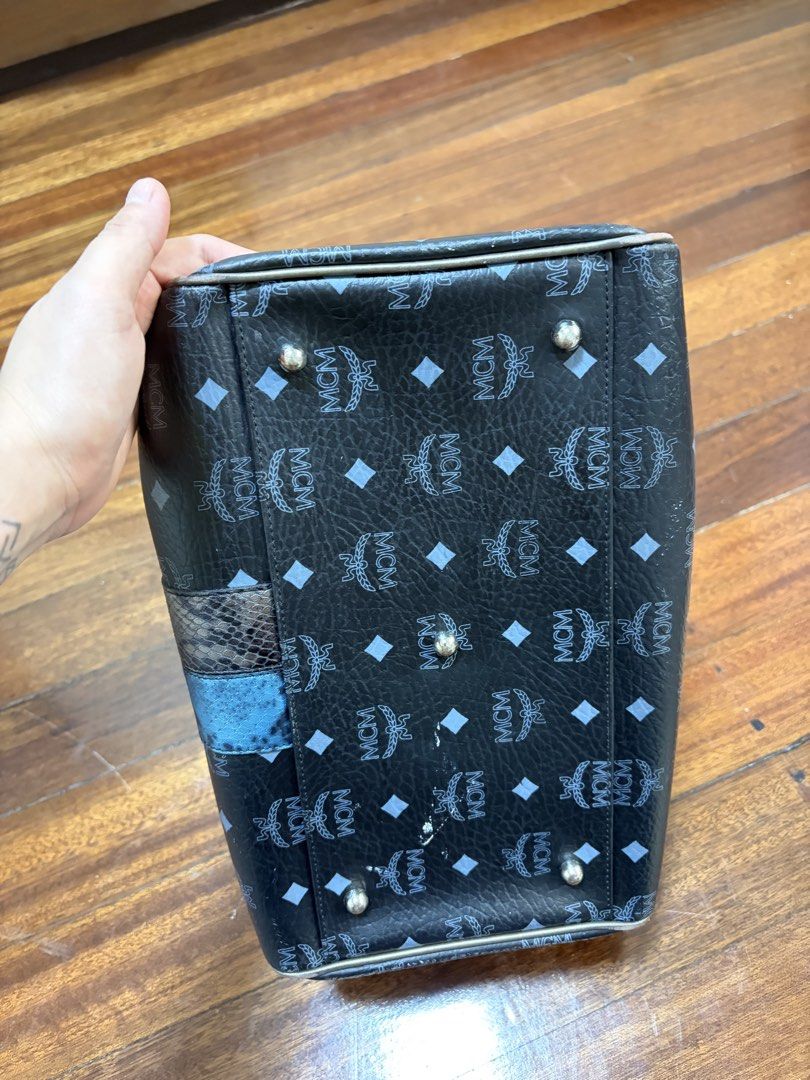 MCM Boston bag (Category: Luxury Bags & Wallets) located in Bulacan. Submitted by declutteringsizzie (Listing ID 1451574686, Image 2). Description: Selling this beautiful MCM handbag in black with signature monogram print. A classic and versatile piece that never goes out of style. ✔️ Zip closure ✔️ Dual handles ✔️ Spacious interior ✔️ Perfect for daily use or collections Used once only! And hindi na ginamit dinisplay with care. .