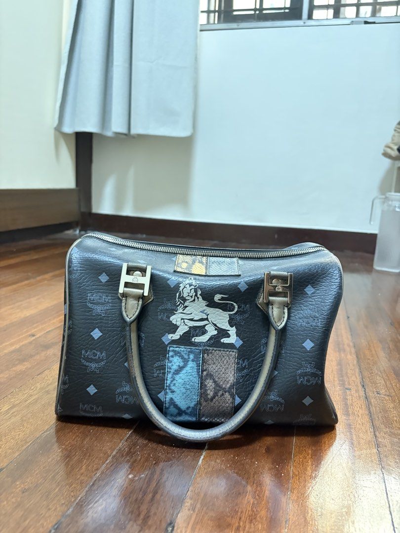MCM Boston bag (Category: Luxury Bags & Wallets) located in Bulacan. Submitted by declutteringsizzie (Listing ID 1451574686, Image 1). Description: Selling this beautiful MCM handbag in black with signature monogram print. A classic and versatile piece that never goes out of style. ✔️ Zip closure ✔️ Dual handles ✔️ Spacious interior ✔️ Perfect for daily use or collections Used once only! And hindi na ginamit dinisplay with care. .