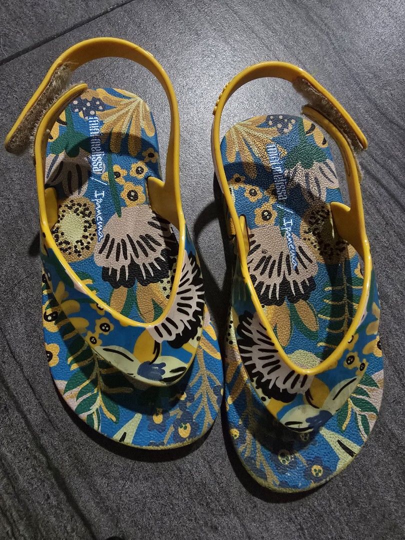Mini Melissa / Ipanema Kids Sandals (Category: Babies & Kids Fashion) located in Makati City. Submitted by zshar (Listing ID 1451569866, Image 1). Description: - Adorable kids sandals with a vibrant floral print. - Bright yellow straps with a secure buckle closure. - Ideal for beach outings or everyday casual wear. - Designed for easy slip-on and slip-off convenience. - Comfortable and perfect for little feet..