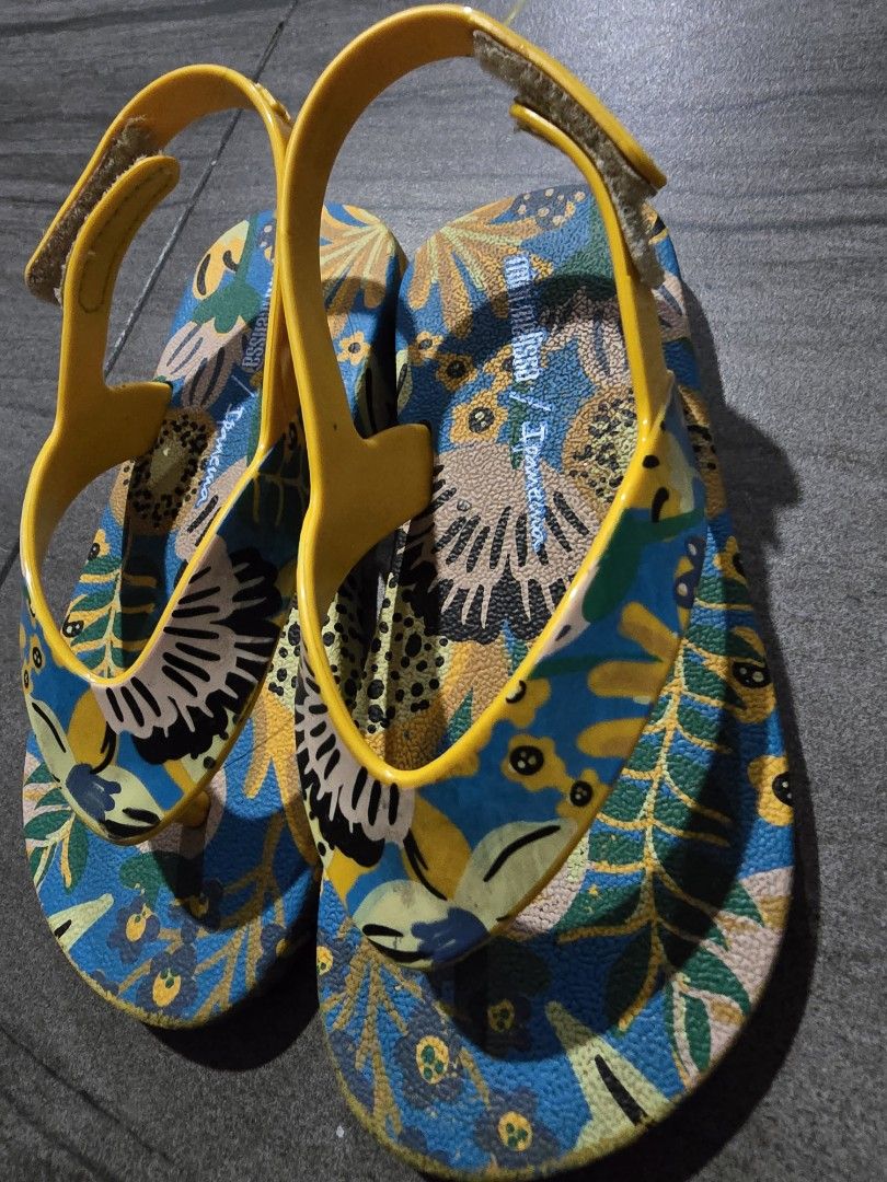 Mini Melissa / Ipanema Kids Sandals (Category: Babies & Kids Fashion) located in Makati City. Submitted by zshar (Listing ID 1451569866, Image 3). Description: - Adorable kids sandals with a vibrant floral print. - Bright yellow straps with a secure buckle closure. - Ideal for beach outings or everyday casual wear. - Designed for easy slip-on and slip-off convenience. - Comfortable and perfect for little feet..