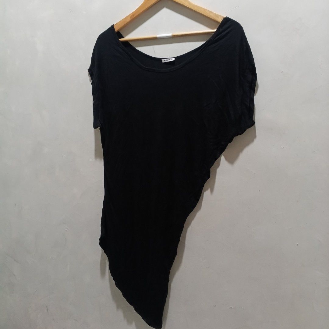 Miu Miu Black Asymmetrical Tunic Top (Category: Others Tops) located in Malasiqui. Submitted by drie_findss (Listing ID 1451599106, Image 2). Description: Miu Miu Asymmetric Short Sleeve (Authentic) ‎_______________________ ‎Size: 36 on tag ‎(Measured by Inches) ‎Width: 22 ‎Length: 38 ‎Condition: EXCELLENT ‎Color Rate: 10/10 ‎Issue: None ‎_______________________ ‎ ‎Color may vary due to lightning so check wisely. ‎Thank you for your understanding