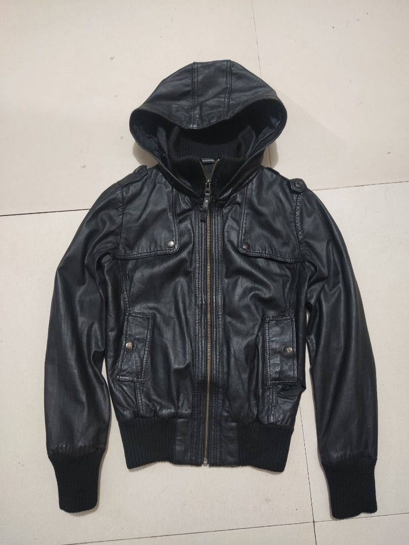 MANGO Black Leather Jacket (Category: Coats, Jackets and Outerwear) located in Davao. Submitted by xhiyska.thrift (Listing ID 1451664329, Image 2). Description: - Genuine Black MNG Sheep Leather - Hooded Bomber Style - Ribbed Cuffs and Hem - Two Buttoned Chest Pockets - Two Side Pockets - Zipper Closure - Polyester/Cotton Blend Lining - Ideal for Casual Wear This is pre loved not thrifted Just pm for more pictures and honest issue.