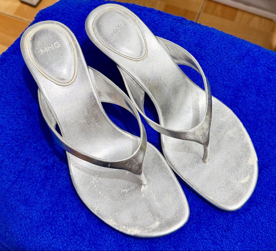 MNG Silver Thong Sandals Heels Size 38 (Category: Heels) located in Quezon City. Submitted by pusa.ck (Listing ID 1451629553, Image 1). Description: - MNG silver thong sandals - Size 38 - Features a heel - Perfect for casual outings.