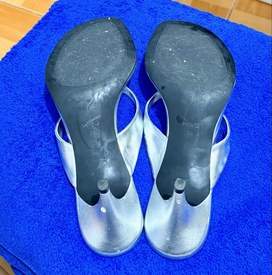 MNG Silver Thong Sandals Heels Size 38 (Category: Heels) located in Quezon City. Submitted by pusa.ck (Listing ID 1451629553, Image 2). Description: - MNG silver thong sandals - Size 38 - Features a heel - Perfect for casual outings.