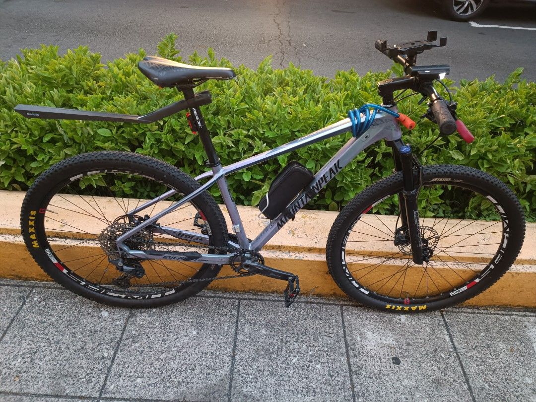 Mountainpeak Mountain Bike - Shimano Deore (Category: Bicycles) located in Quezon City. Submitted by merchantjosh (Listing ID 1451644274, Image 3). Description: - Mountainpeak mountain bike - Equipped with Shimano Deore derailleur - Features Maxxis tires - Perfect for trail adventures and off-road riding - Shows minor scuffs from normal use - Message for more details - 2 Brand New Interior Tires included, Front light, rear light, mud guard, and t