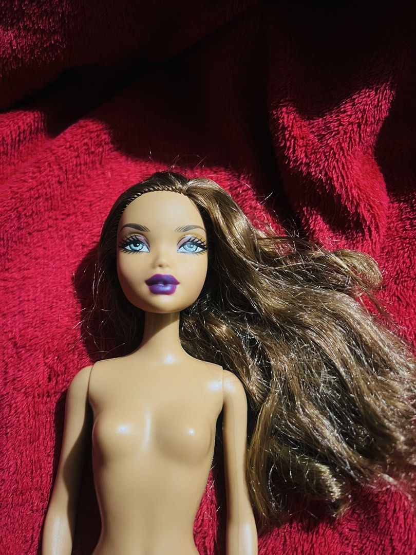 My scene madison (unknown line) (Category: Kids Toys) located in Manila. Submitted by happydays.com (Listing ID 1451614672, Image 1). Description: - Nude fashion doll - Long, wavy brown hair - Bright blue eyes - Vibrant purple lips - Ideal for collectors or imaginative play Flaws on hand only See attached photos for reference..