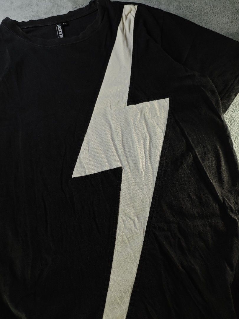 Neil Barrett Huge Thunder Bolt Tee (Category: Tshirts & Polo Shirts ) located in San Pedro. Submitted by chronothrift (Listing ID 1451546816, Image 2). Description: - Size: Large (W21" x 27"L) - Condition: 8/10 - Color Rate: 8.5/10 - Flaws: Slightly Loose Neck, Discoloration, 1 Minimal Pinhole (Last Photo) MOD: J&T Express / Lalamove / Meet MOP: Gcash / Bank Transfer.