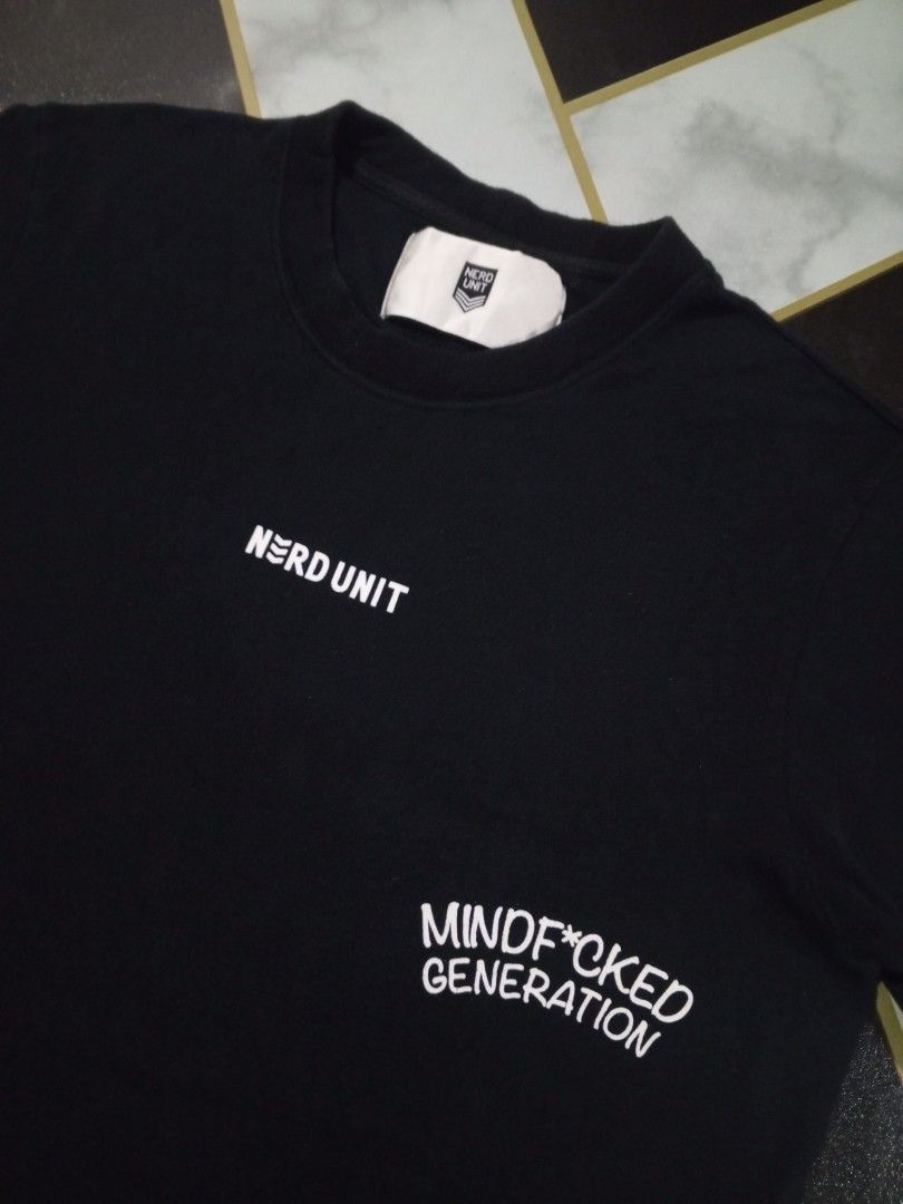 NERDUNIT (Category: Tshirts & Polo Shirts) located in Sekinchan. Submitted by pakaianpertamasaya (Listing ID 1451691199, Image 3). Description: ➡️P19 L26 ➡️preloved like new,, design & backhit cun,, grab fast guys,, cheapest in the town - Black NERDUNIT t-shirt - Features 'Mindf*cked Generation' graphic and brain illustration on the back - Small NERDUNIT logo and text on the front left chest - Brand new with tag attached to sleeve - Perfect for c