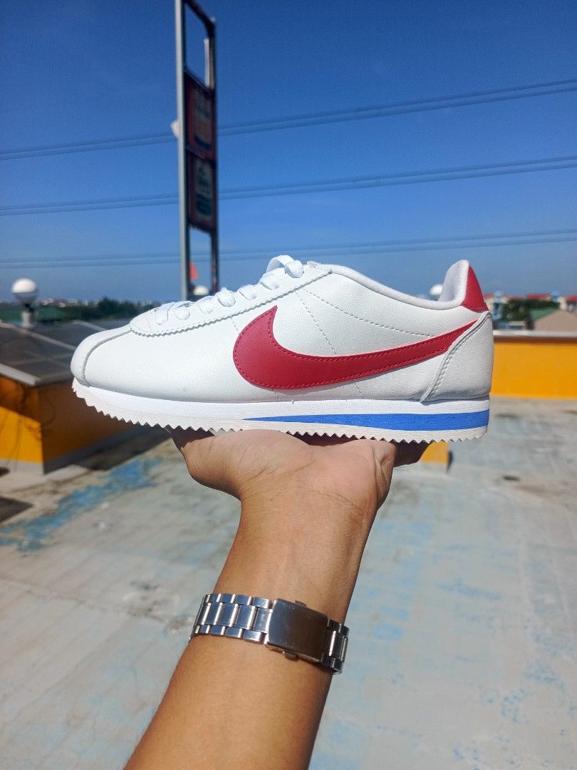 Nike Cortez White Red Blue Leather Sneakers (Category: Sneakers) located in Caloocan City. Submitted by romkicks (Listing ID 1451661464, Image 1). Description: - Classic Nike Cortez - Color: White leather with red swoosh and blue stripe - Includes original box - Ideal for casual wear - Timeless and iconic design.