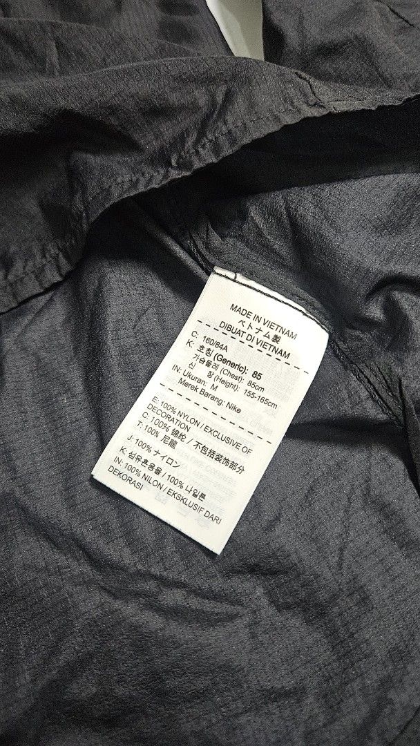 Nike Packable Running Jacket Black M (Category: Coats, Jackets and Outerwear) located in Alfonso. Submitted by jbcamet (Listing ID 1451675378, Image 3). Description: - Black Nike running jacket - Size: Medium (M) - Lightweight and packable design - Features a half-zip closure and hood - Reflective details on sleeves for visibility - Made in Vietnam.