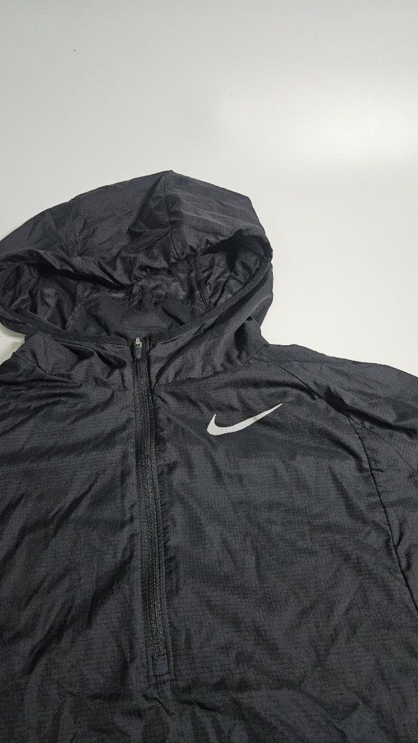 Nike Packable Running Jacket Black M (Category: Coats, Jackets and Outerwear) located in Alfonso. Submitted by jbcamet (Listing ID 1451675378, Image 2). Description: - Black Nike running jacket - Size: Medium (M) - Lightweight and packable design - Features a half-zip closure and hood - Reflective details on sleeves for visibility - Made in Vietnam.