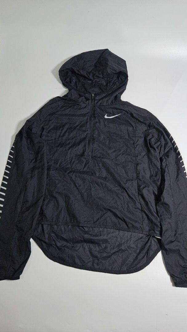 Nike Packable Running Jacket Black M (Category: Coats, Jackets and Outerwear) located in Alfonso. Submitted by jbcamet (Listing ID 1451675378, Image 1). Description: - Black Nike running jacket - Size: Medium (M) - Lightweight and packable design - Features a half-zip closure and hood - Reflective details on sleeves for visibility - Made in Vietnam.