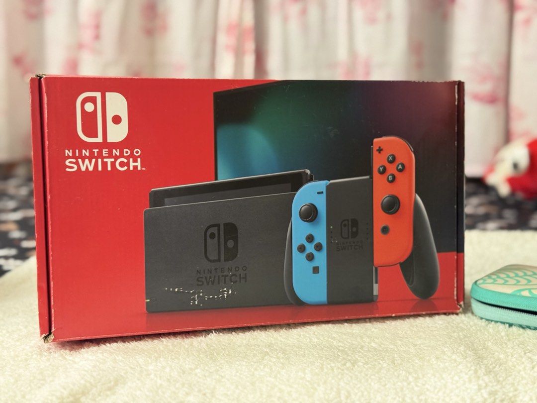 Nintendo Switch V2 Complete Set – Excellent Condition (Category: Nintendo) located in Digos. Submitted by veromaean66021 (Listing ID 1451567009, Image 3). Description: Selling my Nintendo Switch V2 in excellent condition. Everything is fully functional and well maintained. Included: * Nintendo Switch V2 Console * Original Dock * Original Joy-Con Controllers * Original Charger * HDMI Cable * Joy-Con Grip & Straps * Original Box * Animal Crossing C