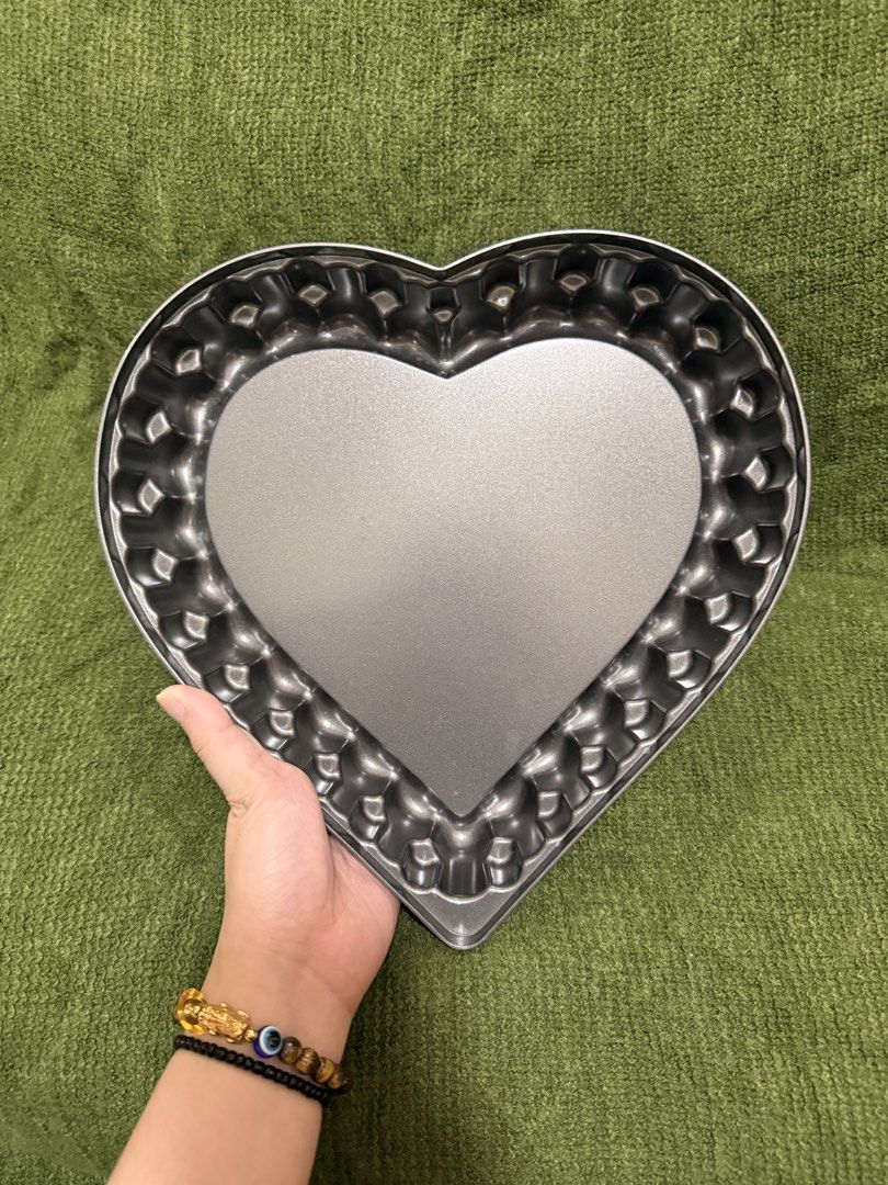 Nordic Ware Elegant Heart Bundt Pan (Category: Bakeware) located in Manila. Submitted by georgethjafine (Listing ID 1451686511, Image 2). Description: - Heart-shaped baking pan - Perfect for cakes, pies, or quiches - Features a decorative fluted edge - Non-stick surface for easy release - Simple to clean - Great for Valentine's Day or any special occasion.