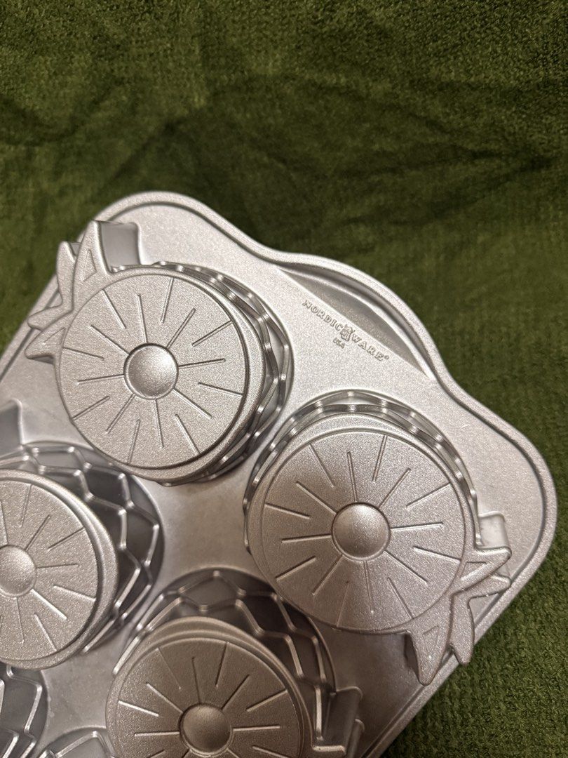 Nordic Ware Pineapple Upside Down Mini Cake Pan (Category: Bakeware) located in Manila. Submitted by georgethjafine (Listing ID 1451687074, Image 3). Description: - Brand: Nordic Ware - Design: Pineapple Upside Down Mini Cake Pan - Makes 6 individual pineapple-shaped cakes - Durable construction for even baking - Perfect for desserts and parties.