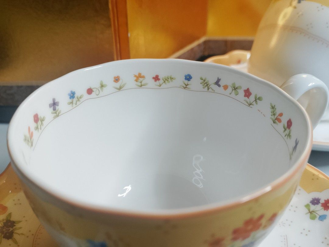 Noritake Earthenware "True Love" Teacup and Saucer Set (Category: Coffee & Tea Tableware) located in Valenzuela. Submitted by buylaaaaa (Listing ID 1451558617, Image 3). Description: - Noritake "True Love" Teacup and Saucer Set - Features a charming yellow band with delicate floral patterns - Microwave, oven, and dishwasher safe for convenience - Crafted with quality in Japan - Ideal for enjoying your morning tea or coffee - 1duo available.