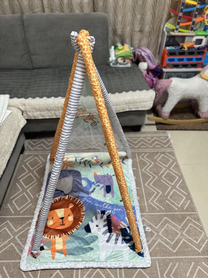 Nuby Baby Play Gym (Category: Infant Playtime) located in Binan City. Submitted by thelittleloop (Listing ID 1451624256, Image 2). Description: - Soft and padded play mat - Overhead arches with giraffe and striped pattern - Ideal for tummy time and sensory development - Easy to fold and store.