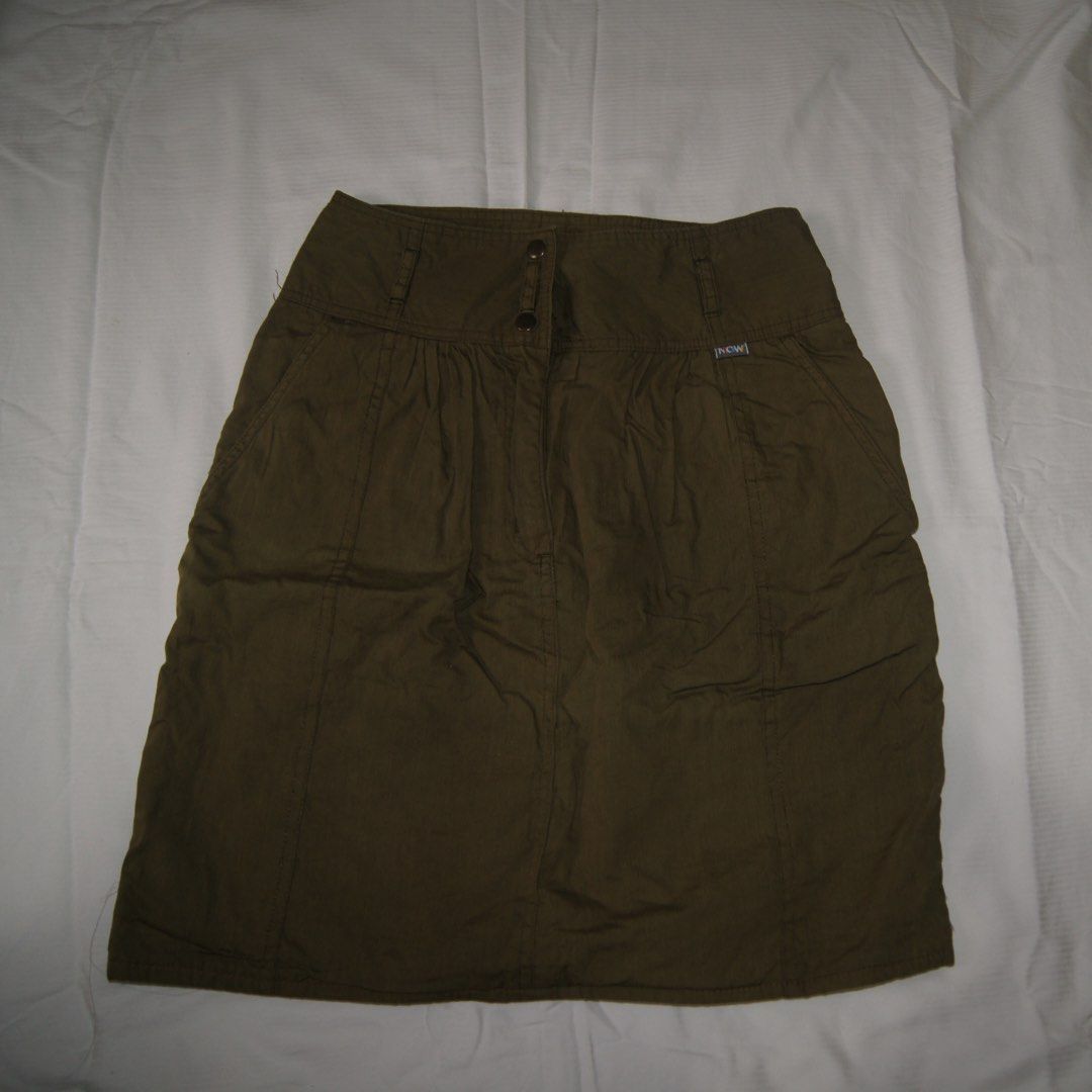 Olive Green High-Waisted Skirt (Category: Skirts) located in Iloilo. Submitted by 080789 (Listing ID 1451675270, Image 1). Description: - Olive green high-waisted skirt - Gathered waist detail - Two button closure at the front - Two functional side pockets - Slightly crinkled fabric texture.