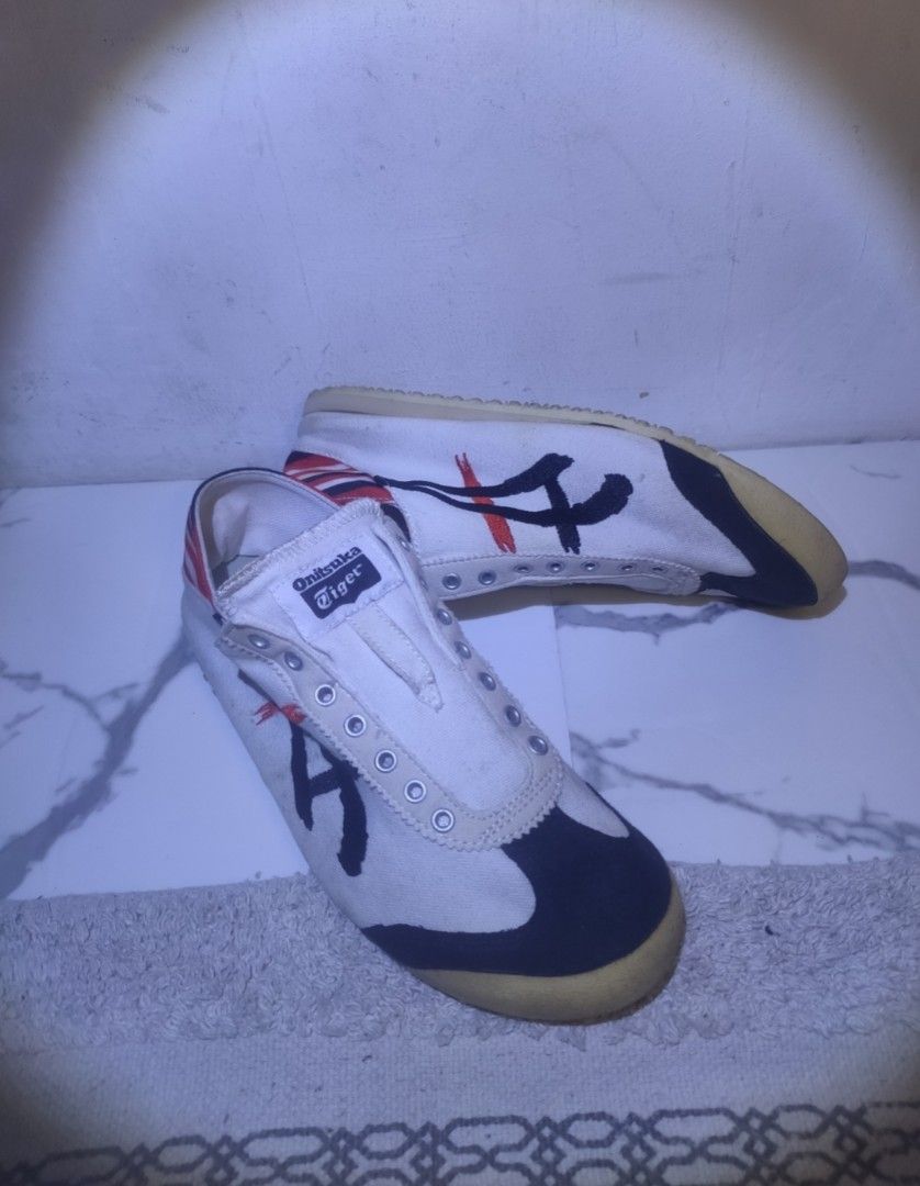 Onitsuka Tiger Mexico 66 Sneakers White Black Red (Category: Sneakers) located in Imus. Submitted by jane369 (Listing ID 1451621982, Image 2). Description: - Classic Onitsuka Tiger Mexico 66 - Color: White with black and red accents - Style: Low-top, perfect for casual wear - Condition: Shows some signs of wear on soles and canvas - Note: Laces are missing - Brand: Onitsuka Tiger (by ASICS) ​ - Line: Mexico 66 Deluxe • NIPPON MADE (premium Japane