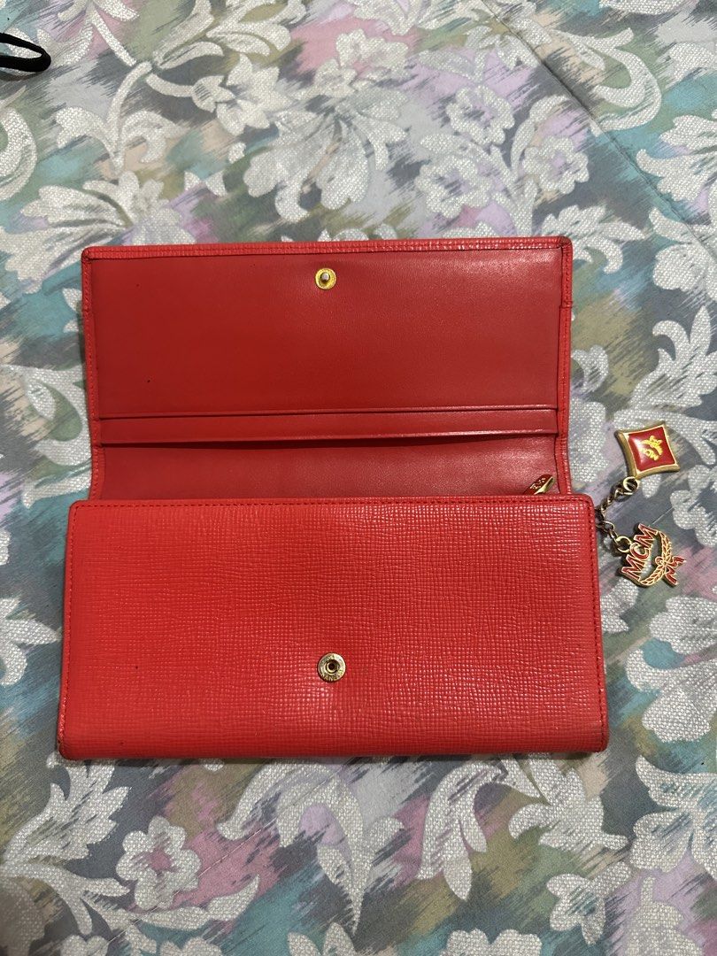 ORIGINAL MCM Red Leather Long Wallet with Charms (Category: Luxury Bags & Wallets) located in Naga. Submitted by bag.net (Listing ID 1451649367, Image 3). Description: - Authentic red MCM long wallet(money back 💯 guaranteed if fake) - Genuine leather with signature MCM logo details - Adorable MCM charms attached - Ample card slots and compartments for organization - Includes a secure zipper pocket -stunning in actual🥰.