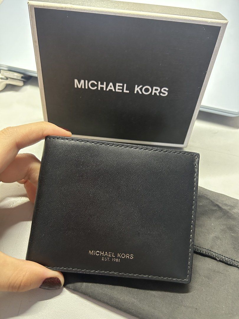 Original Michael Kors Leather Bifold Wallet For Men (Category: Wallets & Card Holders) located in Paranaque City. Submitted by fielasanik-anik (Listing ID 1451696325, Image 1). Description: - wallet is original and given as a gift ( no receipt) - never been used and naka tago lang sa box (original packaging) - can do meetups (lrt redemptorist and feu manila) - can ship thru lalamove and j&t.