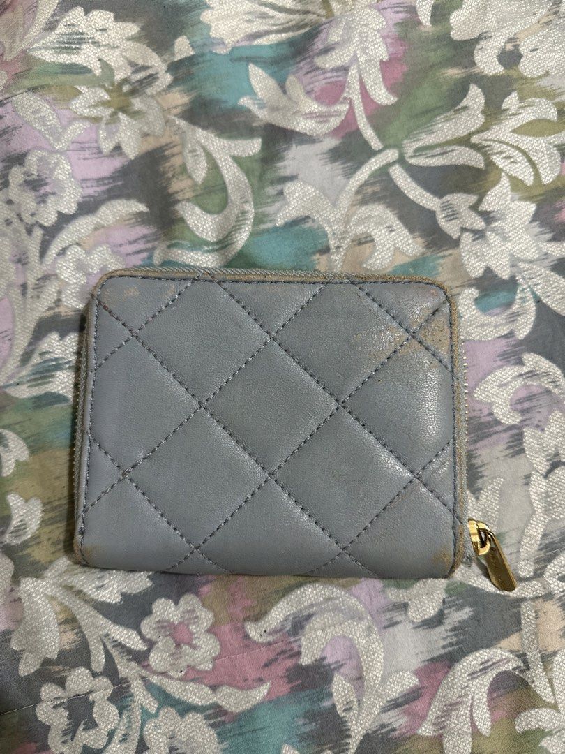 ORIGINAL Michael Kors Quilted Leather Zip Around Wallet (Category: Wallets & Card holders) located in Naga. Submitted by bag.net (Listing ID 1451667346, Image 2). Description: - Light blue Michael Kors wallet - Quilted leather with gold hardware - Zip around closure - Ample card slots and coin pocket - Shows some wear on edges and corners, but plenty of life left.