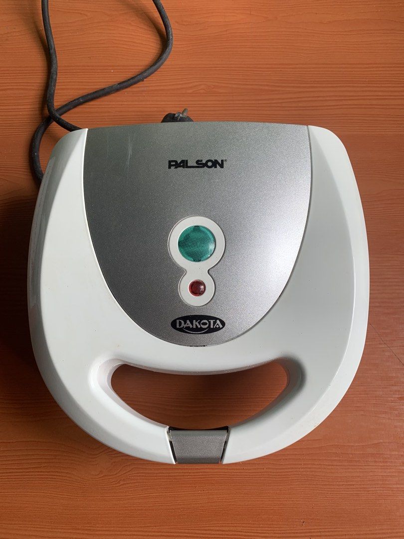 Palson Dakota Sandwich Maker (Category: Cookware & Accessories) located in Antipolo. Submitted by rex.dn (Listing ID 1451673295, Image 2). Description: * Excellent condition * Fully functional (tested) * Heats properly; indicator lights working * Barely used * Non-stick cooking plates * Includes original box * Ready to use Price is negotiable for sure buyers. RFS: Decluttering.