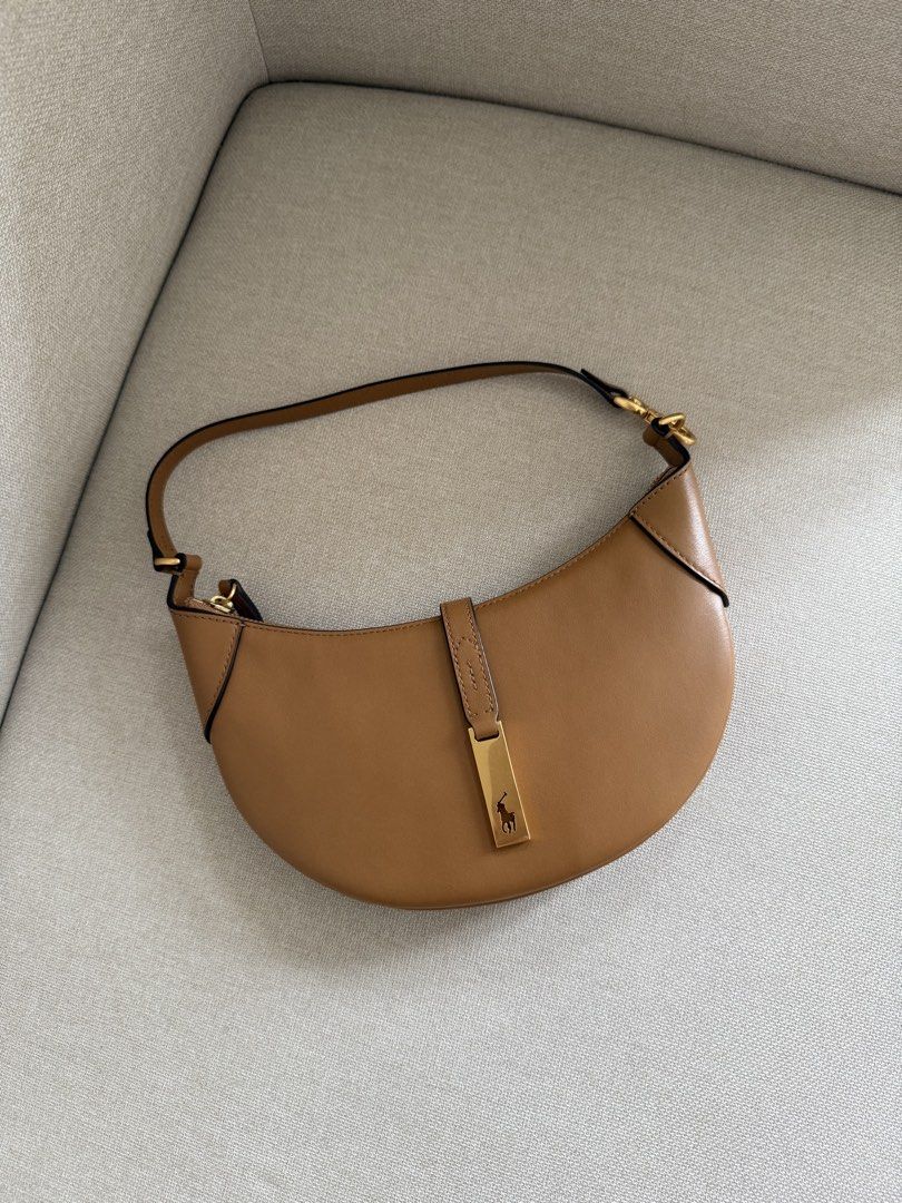 Polo Ralph Lauren Saddle Bag Tan Leather (Category: Luxury Bags & Wallets) located in Manila. Submitted by ella1222 (Listing ID 1451537049, Image 1). Description: - Authentic Polo Ralph Lauren saddle bag - Color: Tan leather - Condition: Worn only twice, with tags still attached - Includes: Original dust bag, shopping bag, and tags - Versatile: Ideal for everyday use or special occasions -Negotiable.
