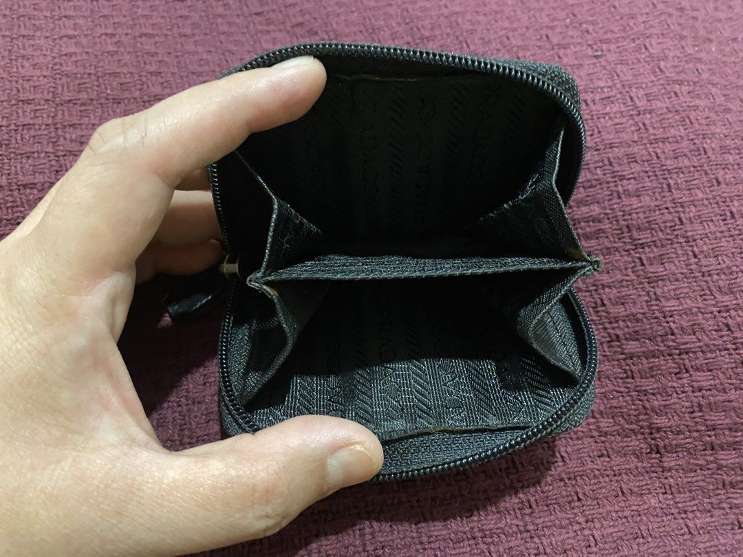 Prada Black Nylon Coin Pouch (Category: Luxury Bags & Wallets) located in Muntinlupa City. Submitted by mj.finds (Listing ID 1451612706, Image 3). Description: - Prada coin pouch - Black nylon material - Zipper closure - Two interior compartments - Small and compact for coins.