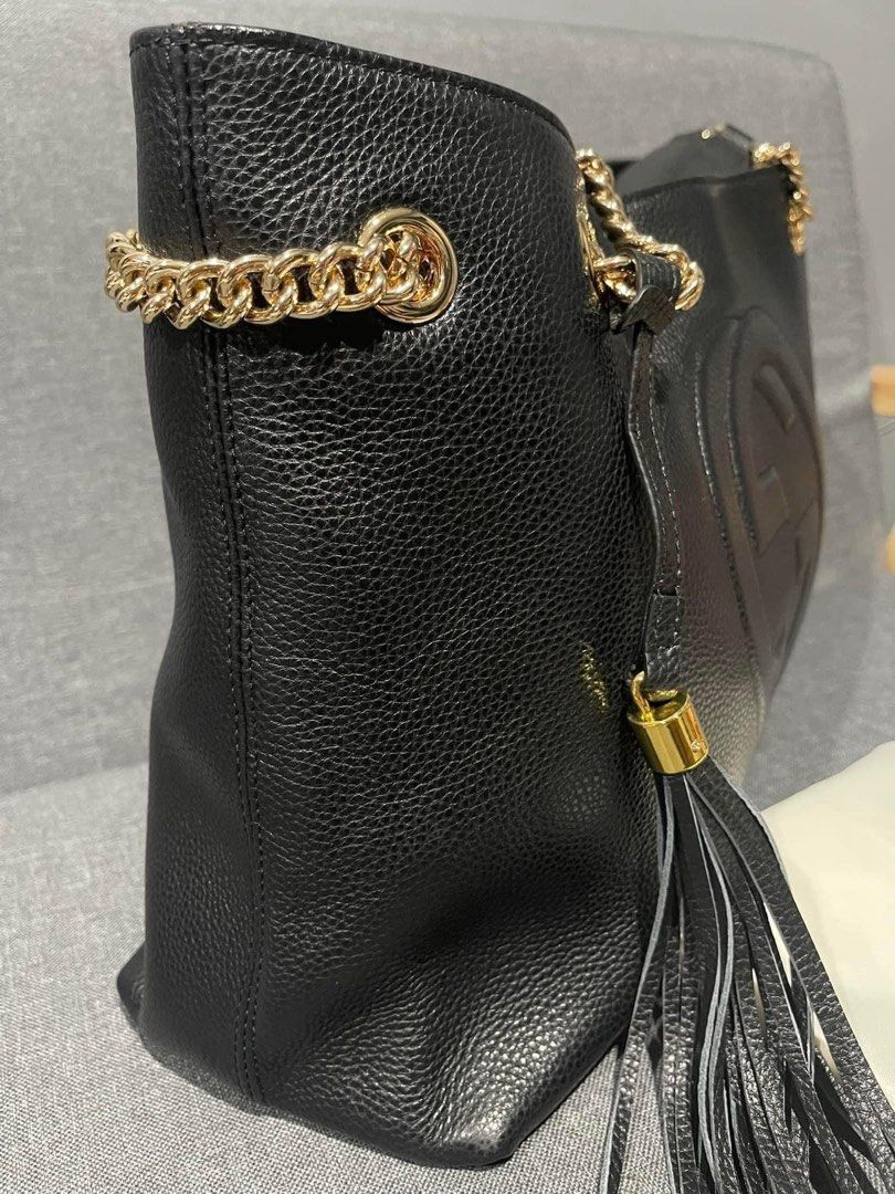 Preloved gutzzi soho leather tote bag (Category: Luxury Bags & Wallets) located in Los Banos. Submitted by ditasbautista2329 (Listing ID 1451663929, Image 3). Description: Premium pebbled leather • Iconic embossed GG logo • Gold-tone chain shoulder straps • Leather tassel accent • Spacious interior • Color: Cognac/black • Elegant at versatile design.
