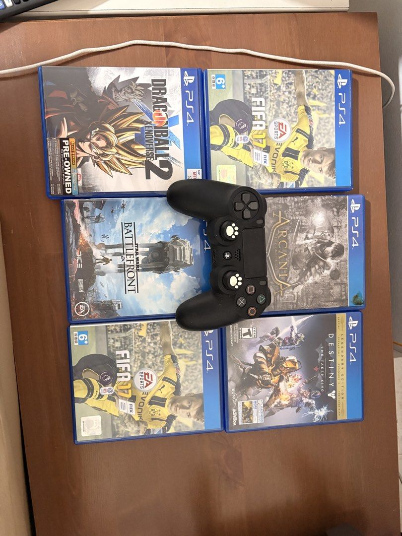 PS4 Controller + Games Bundle (Category: Controllers) located in Singapore. Submitted by it666 (Listing ID 1451635419, Image 1). Description: PS4 Controller + Games Bundle • 1 × PS4 Wireless DualShock Controller (Black). Not used for 5 years, but still charges. • 6 × PS4 games included. • Selling all together for $40. Condition: Sold As-/s Collection: Self-collect at postal code 760395.