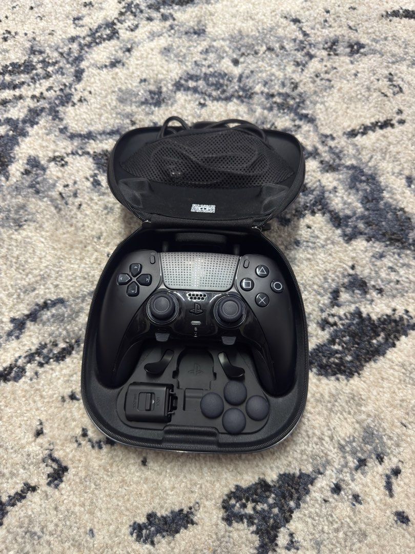 PS5 DualSense Edge controllers (white and midnight black) + cases and accessories (Category: Controllers) located in Pasig City. Submitted by robbiseraphin (Listing ID 1451635211, Image 2). Description: 🎮 Selling: PS5 Dualsense Edge controller white edition + case and accessories. No box 💰 For only 8000 php nalang! 🎮 Selling: PS5 Dualsense Edge controller white edition + case and accessories. No box 💰 For only 8000 php nalang! 📍 Items are in