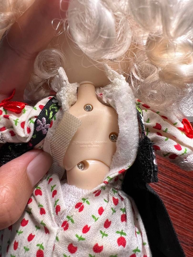 Pullip Dal-Colline (Category: Figurines & Statues) located in Baguio. Submitted by ditoyzb08176 (Listing ID 1451649628, Image 3). Description: - Adorable doll with blonde curly hair and striking red eyes. - Dressed in a charming traditional folk-style floral dress. - Features a black apron over a white blouse with red trim. - Comes with red tights and green shoes. - Neck has manufacturer markings. Location: Baguio City Shipping: J&T/FLASH/LBC .