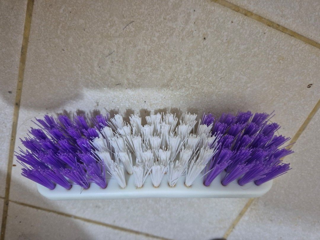 Purple and White Bristle Cleaning Brush with Handle (Category: Hair) located in Manila. Submitted by zotag (Listing ID 1451645807, Image 3). Description: - Sturdy scrubbing brush for tough jobs. - Firm bristles effectively clean floors and surfaces. - Comfortable white handle for easy grip and use. - Attractive purple and white bristle design..