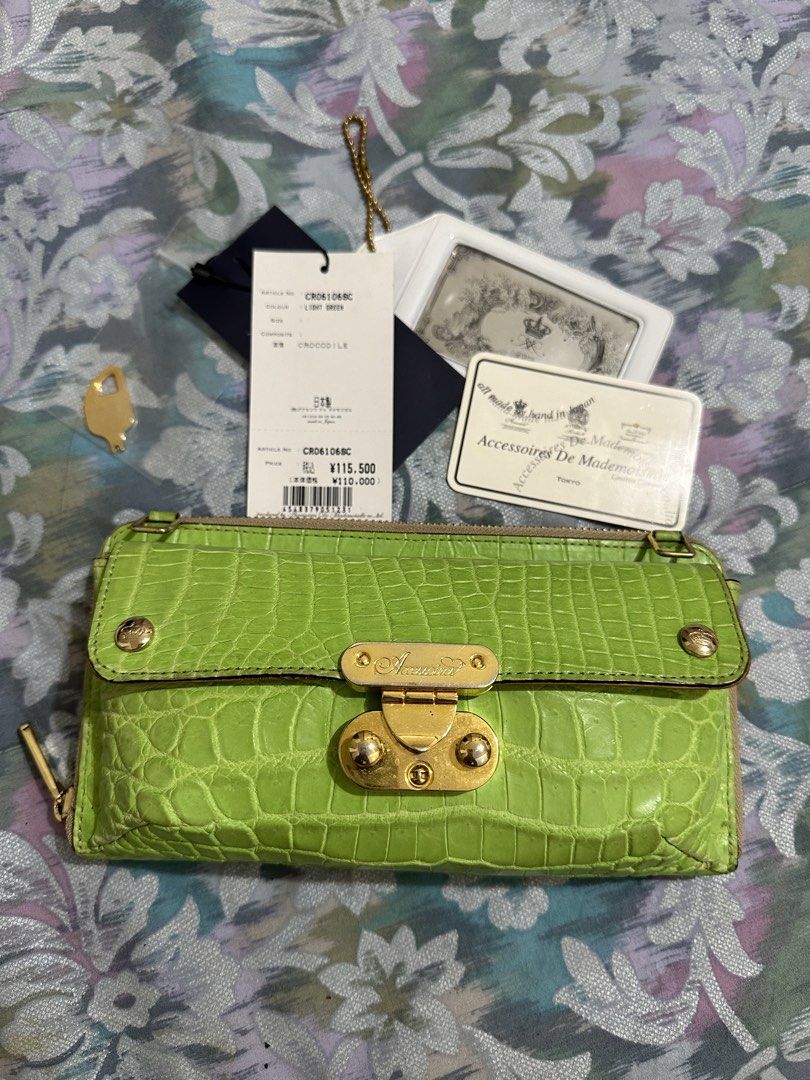 Real Crocodile Embossed Wallet Light Green(branded) (Category: Luxury Bags & Wallets) located in Naga. Submitted by bag.net (Listing ID 1451671631, Image 1). Description: - Light green wallet with elegant real crocodile leather (Made in Japan 🇯🇵) -A luxury wallet from Japan original price is 115,000Yen - Secure gold clasp closure - Convenient side zip pocket - Comes with original tags and authenticity card - Original price: ¥115,500 - Ideal for