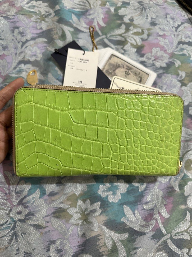 Real Crocodile Embossed Wallet Light Green(branded) (Category: Luxury Bags & Wallets) located in Naga. Submitted by bag.net (Listing ID 1451671631, Image 2). Description: - Light green wallet with elegant real crocodile leather (Made in Japan 🇯🇵) -A luxury wallet from Japan original price is 115,000Yen - Secure gold clasp closure - Convenient side zip pocket - Comes with original tags and authenticity card - Original price: ¥115,500 - Ideal for