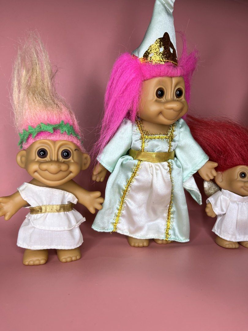 Russ Troll Dolls Set - Princess & Angels (Category: Figurines & Statues) located in Caloocan City. Submitted by snapshop_ph (Listing ID 1451578452, Image 2). Description: - Set of 4 vintage Russ troll dolls, perfect for collectors! - 1 Princess Troll: Dressed in a light blue gown with a crown. - 3 Angel Trolls: Wearing white outfits with wings. - Hair Colors: One pink, one red, and two green. - Authentic Russ branding and 'Made in China' marked o