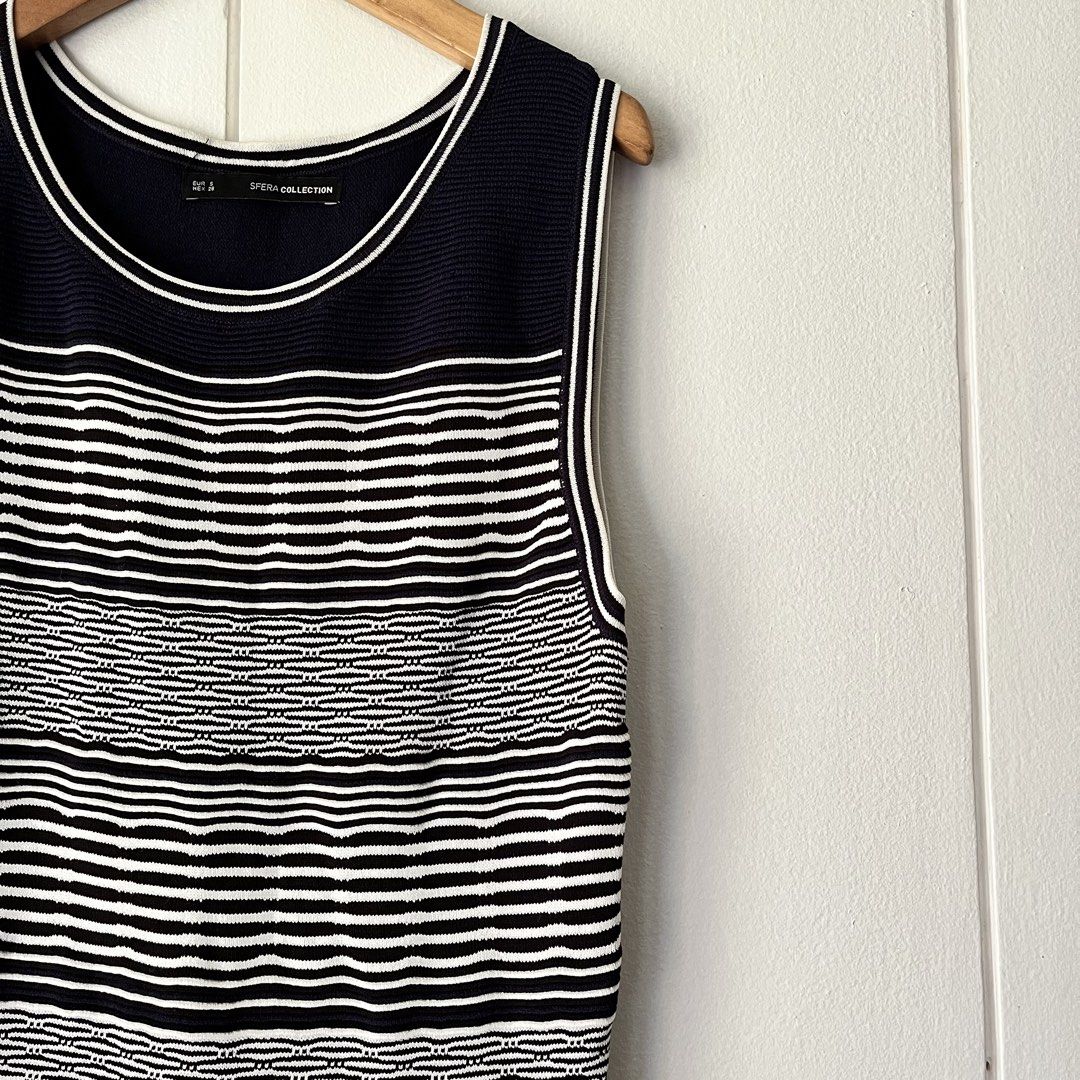 Sfera Stripe Knit Dress (Category: Dresses) located in Quezon City. Submitted by nchm88 (Listing ID 1451544390, Image 2). Description: Sfera stripe knit dress - fitted fit - comfortable to wear - navy blue, black, white stripe - subtle ruffle detail on hemline - hardly used, good as new - in good condition, no damages or stains - size small .