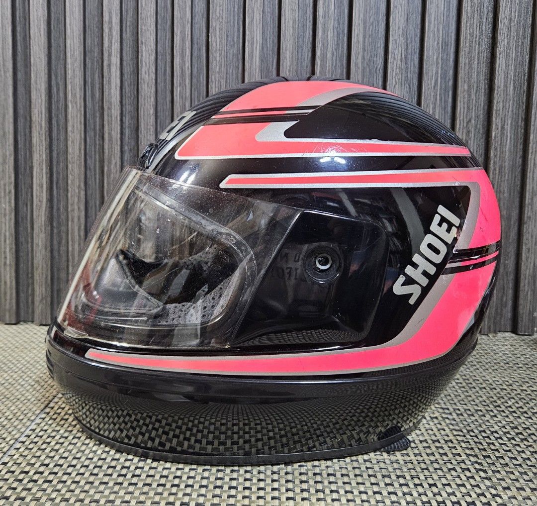 Shoei Motorcycle Helmet - Black Pink Silver (Category: Helmets and other Riding Gears) located in Rizal. Submitted by cherry_garcia (Listing ID 1451583326, Image 3). Description: - Shoei full-face motorcycle helmet / Authentic - Color: Black with pink and silver racing stripes - Visor: Clear - Condition: Visible scuffs and scratches on exterior (especially top), interior is clean - Ready for your next ride.